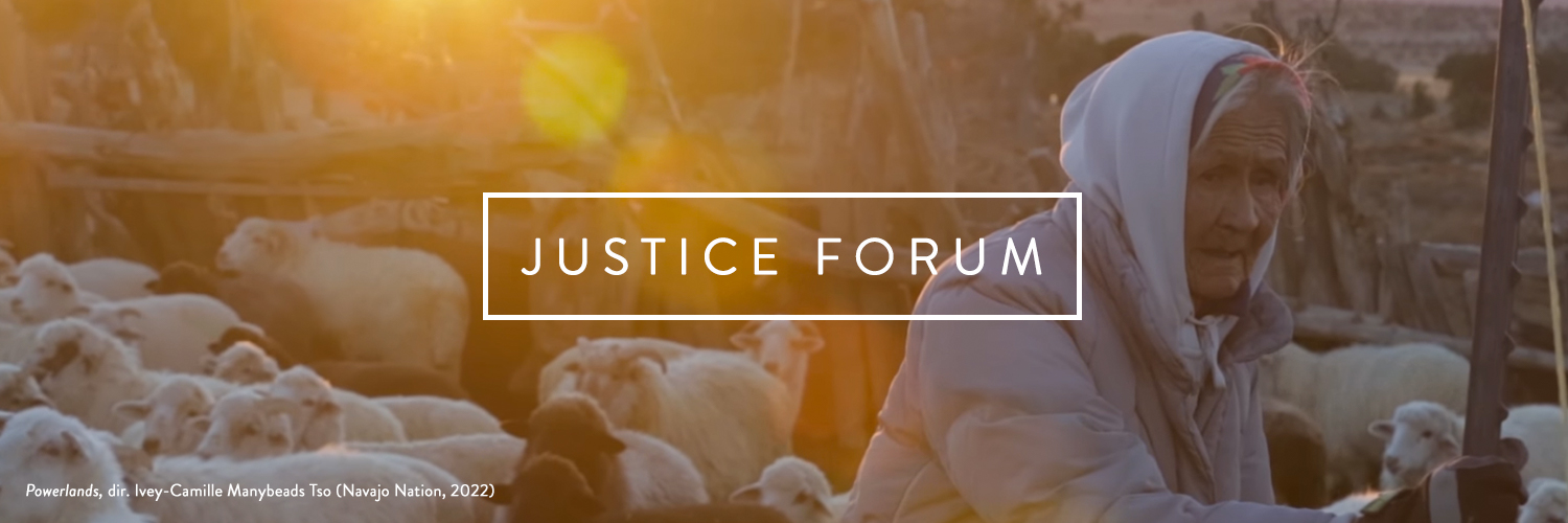 Film still showing woman tending to sheep with solar flare. White text within a white box reads Justice Forum. Still from Powerlands, 2022
