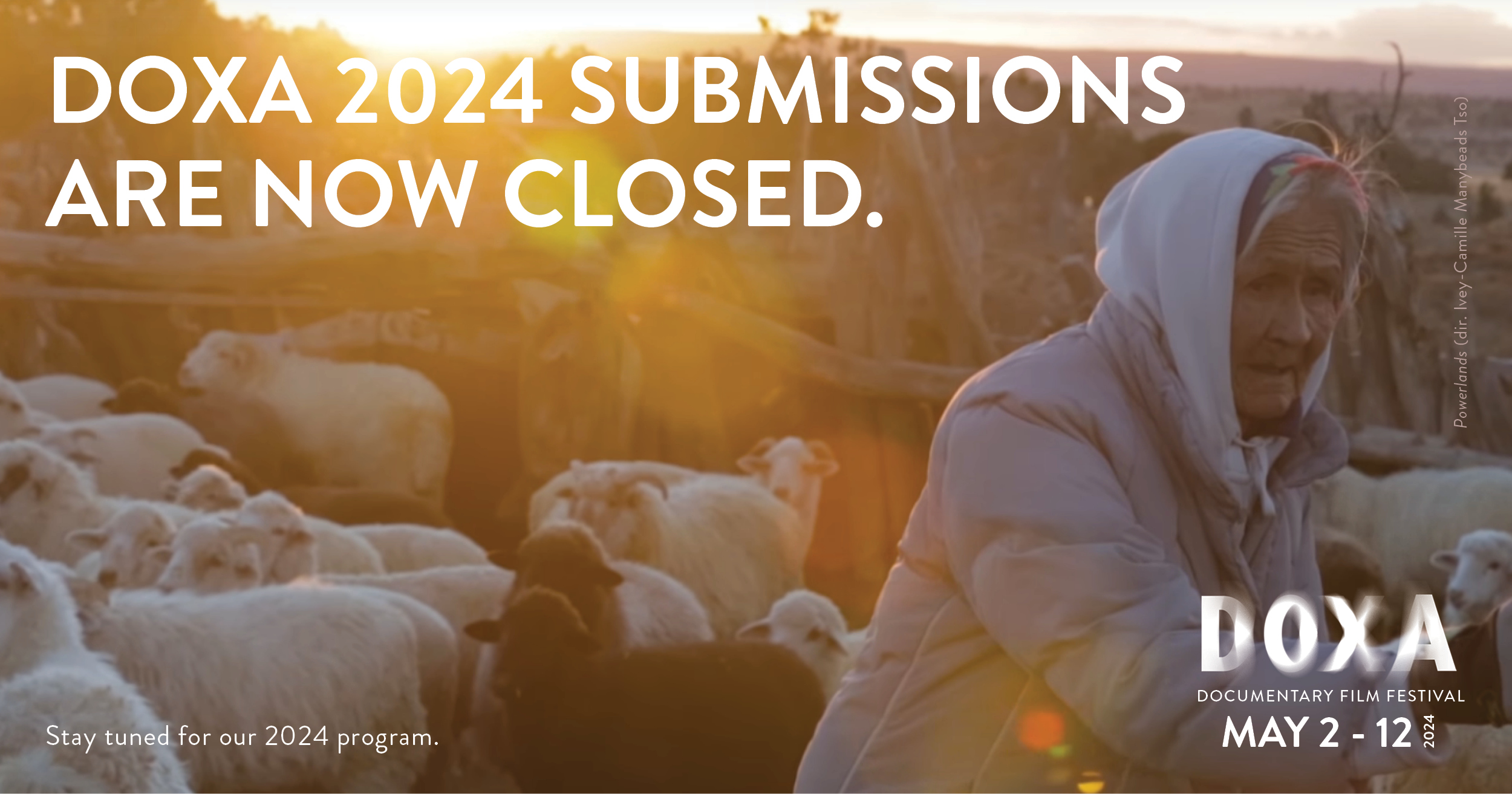 DOXA 2024 Submissions are now closed. Written in white text over an image of an Indigenous shepherd with their flock of sheet at sundown.