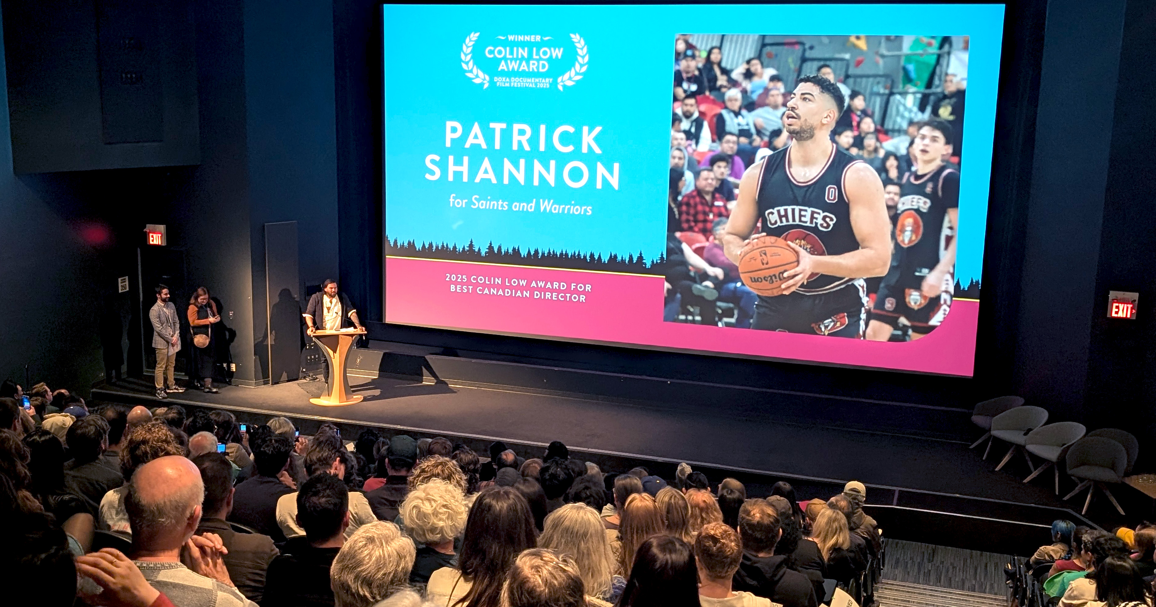 Patrick Shannon at the podium receiving the award for Best Canadian Director at the 2025 closing gala.