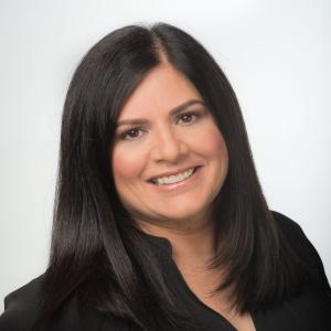 Photo of a woman with dark brown hair.